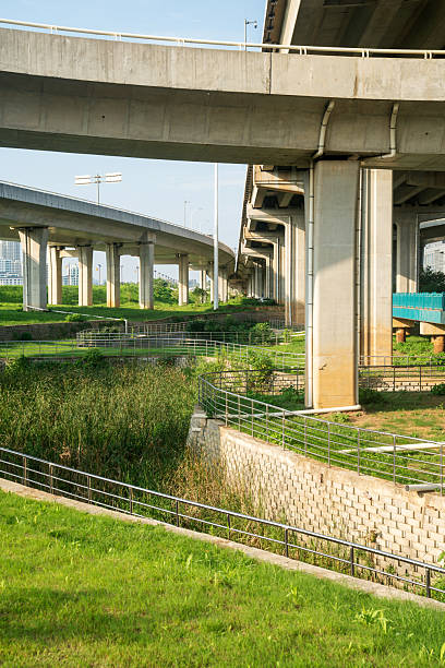 istock Concrete structure and asphalt road space under the overpass in the city 2219040295