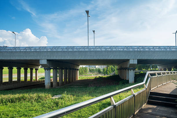 istock Concrete structure and asphalt road space under the overpass in the city 2219040438