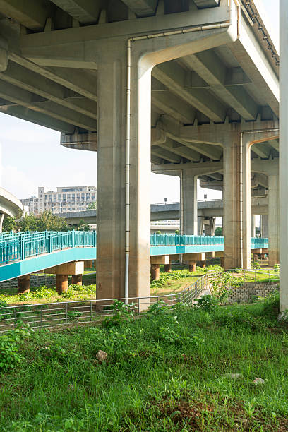 istock Concrete structure and asphalt road space under the overpass in the city 2219040450