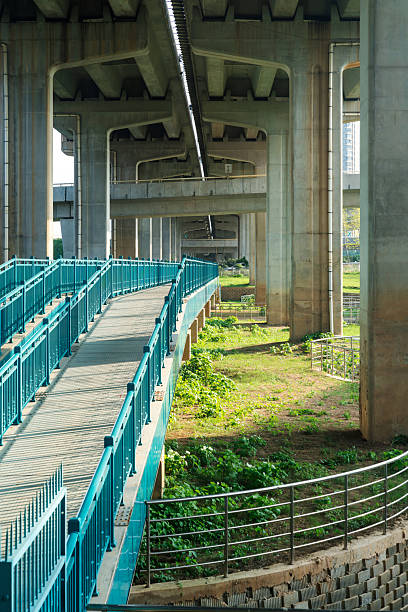 istock Concrete structure and asphalt road space under the overpass in the city 2219040454