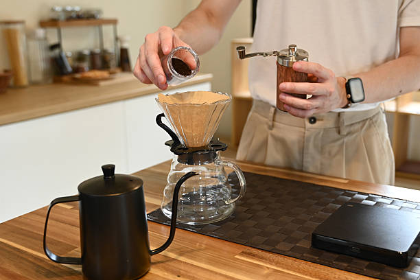 istock A man brewing a drip hot espresso, pour over coffee with hot water and filter paper in kitchen. 2219044066