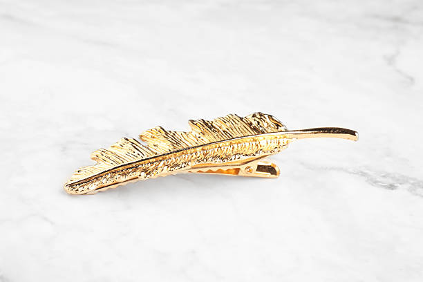 istock Beautiful bijouterie. Elegant hair clip on white marble table, closeup 2219047938