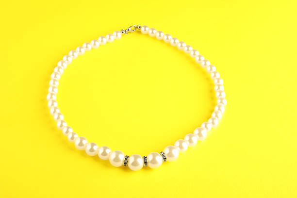 istock Beautiful bijouterie. Stylish bracelet on yellow background 2219047988