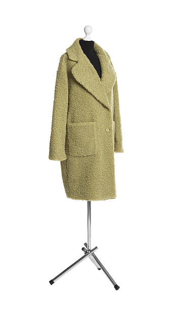 istock Female mannequin with stylish green coat isolated on white 2219048360