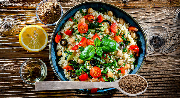 A plate of couscous served with vegetables and chickpeas