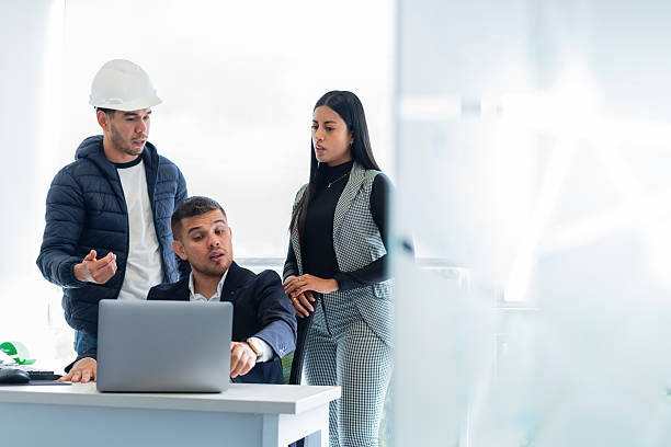 istock Project director presents the design to be worked on to her alternates 2219050829