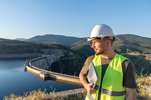 istock Engineer inspecting a dam with laptop for workplace safety 2219052959