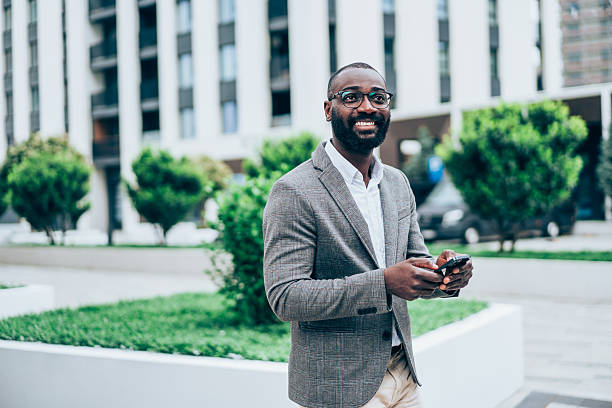 istock Businessman texting outdoors. 2219053163