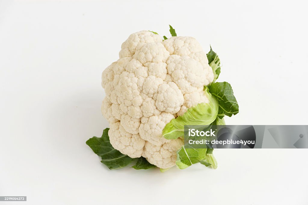 Fresh cauliflower with leaves – isolated on white background Cauliflower Stock Photo Fresh cauliflower with leaves – isolated on white background Cauliflower Stock Photo