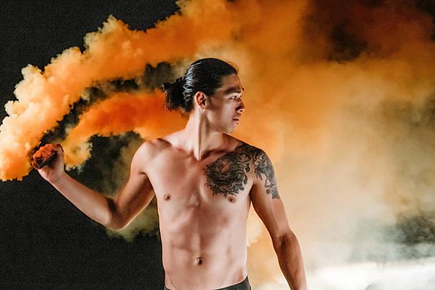 Portrait of young man dancing on party outdoors