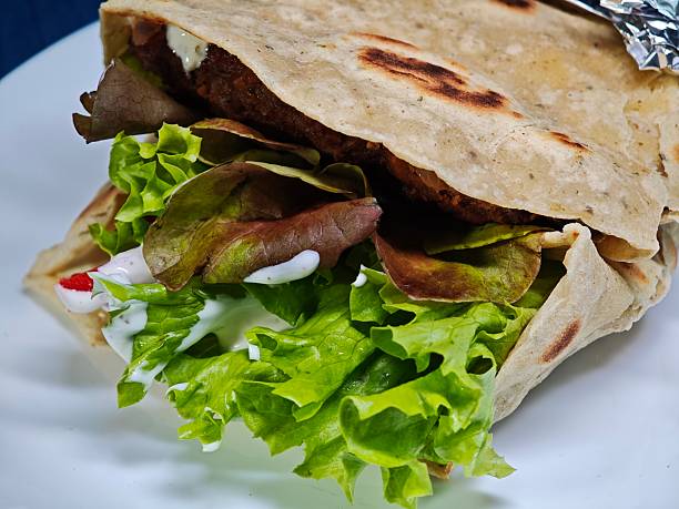 Focus on Semaglutide and food Mini tortilla wraps with boiled chicken breast, roman lettuce, red onion, spinach, tomato and yogurt dressing - under 500 cal lunch