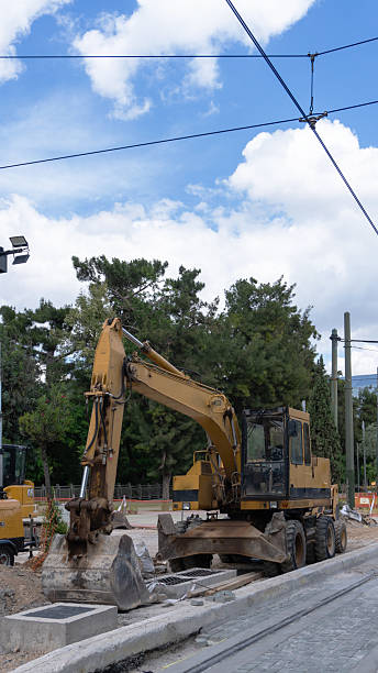istock yellow bulldozer on the city road 2219055103