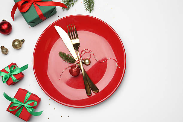 istock Christmas table setting with plate, cutlery and festive decor on white background, flat lay 2219055246