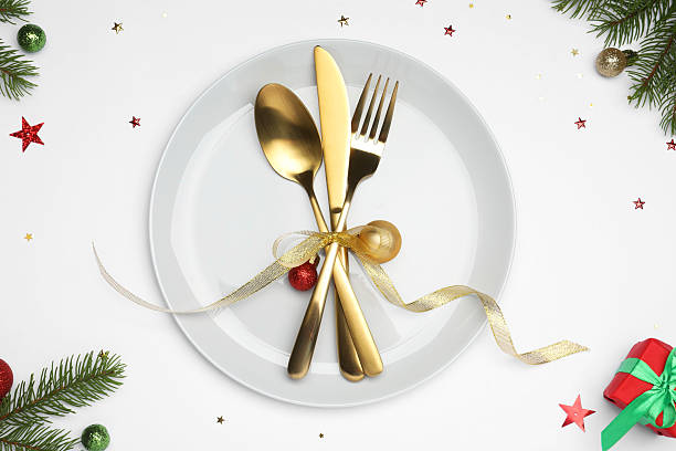 istock Christmas table setting with plate, cutlery and festive decor on white background, flat lay 2219055247