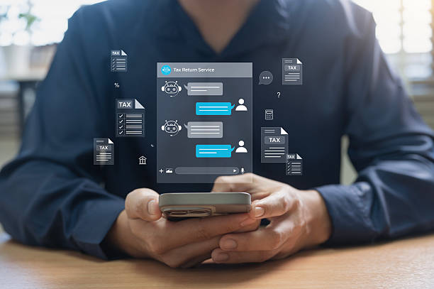 istock Mobile user chatting with AI chatbot for tax return services, showing digital assistant providing tax help, online filing guidance, and document management via smartphone in modern fintech environment 2219055802
