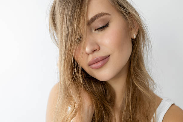 istock Young and pretty female against white background 2219062645