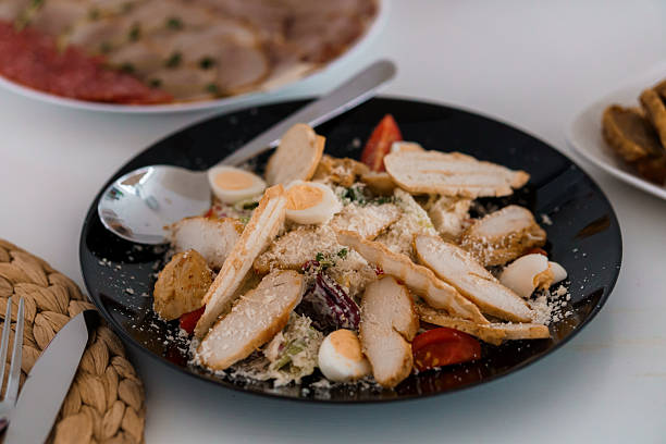 Delicious Chicken Salad with Grated Cheese and Cherry Tomatoes