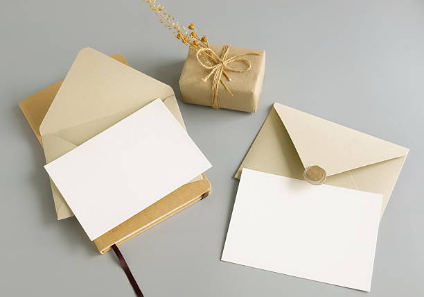 istock Blank paper cards mockup, envelopes and gift box top view on grey blue background. Copy space. 2219064265