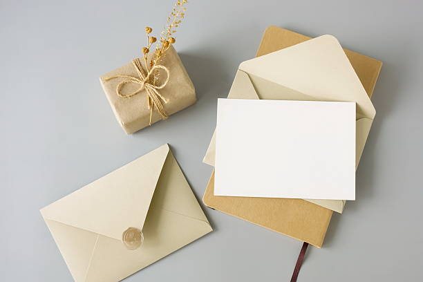 istock Blank paper card mockup, envelopes and gift box top view on grey blue background. Copy space 2219064266