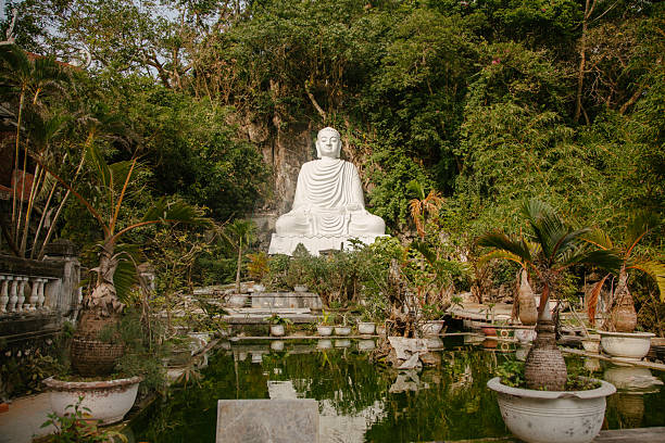 istock Buddha sculpture meditating in the garden 2219066767