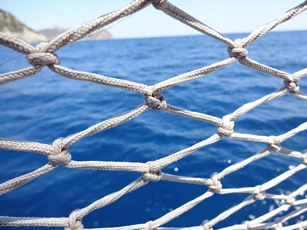 istock A mesh of material that is a decoration on a boat, performing protective functions. Texture or background. Seascape 2219069240