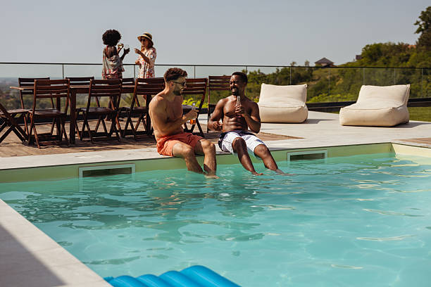 istock Happy Friends Hanging Out by Pool 2219076437