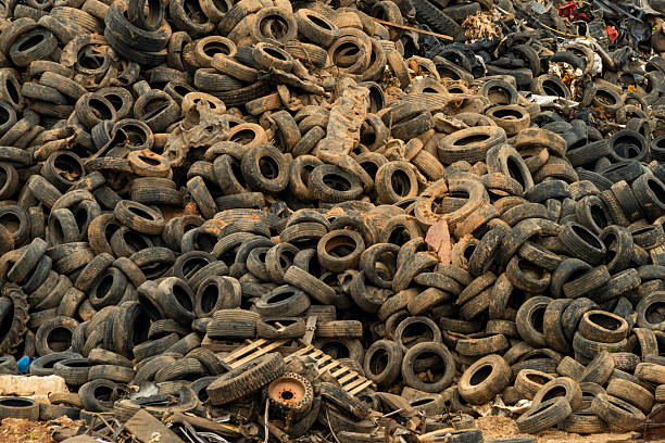 Detail of old damaged and worn car tire, recycling
