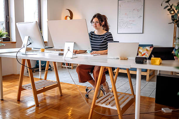 istock Young adult at home surrounded with computers doing computer crime 2219078743