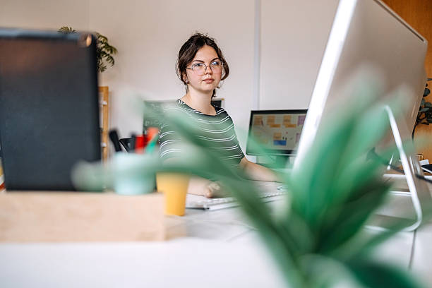 istock Young adult at home surrounded with computers doing computer crime 2219078749