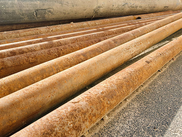 istock Old metal rusty pipes, industrial pipes, construction oxidized iron pipes. 2219088486