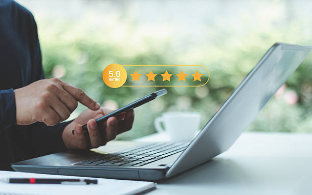 istock Online survey for customer satisfaction experience with client feedback service rating star concept on mobile and laptop for digital business support and review, evaluation and quality support system. 2219088519
