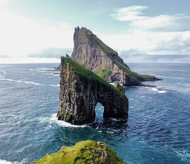 istock Coastal Cliffs and Stunning Natural Arch Formation of Drangarnir 2219091014