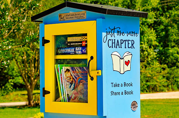 Loxley, Alabama, USA - April 30, 2023: A Little Free Library stands on a street corner in Loxley, Alabama. Little Free Libraries are part of a free, public book exchange program founded in 2009.