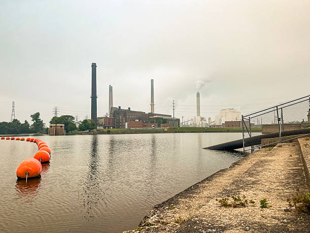istock Power Plant Emits Smoke with Sky Full of Forest Fire Smoke 2219093638