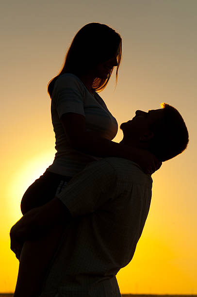 istock Young happy couple having fun in the summer nature 2219095042