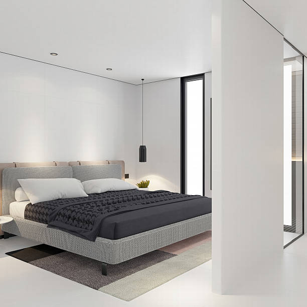 istock Minimalist Modern Bed in a Serene White Bedroom 2219095469