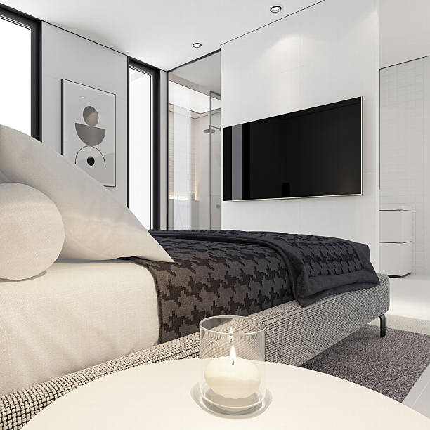 istock Minimalist White Bedroom with Open-Concept Bathroom and Black Accents 2219095593