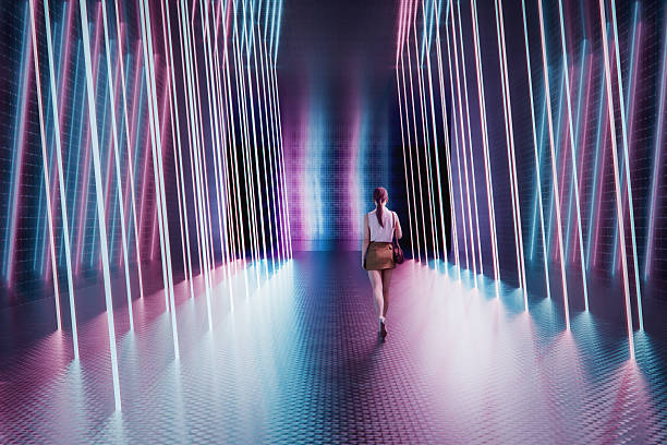 istock Young woman walking in futuristic corridor 2219096037