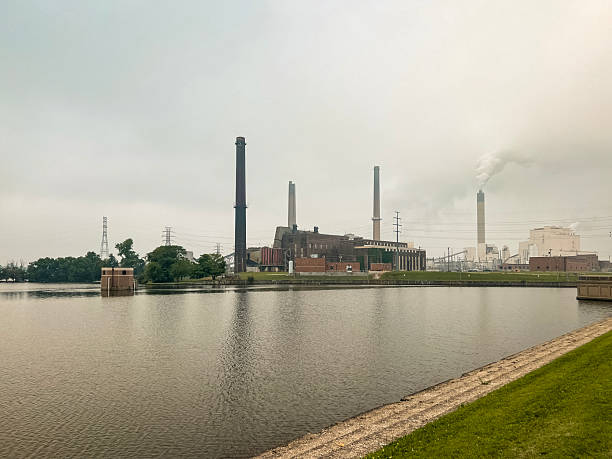 istock Power Plant Emits Smoke with Sky Full of Forest Fire Smoke 2219097513