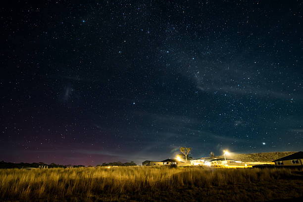 The Southern Lights - Aurora Australis and the night sky filled with stars in Blayney, Central West, NSW, Australia.