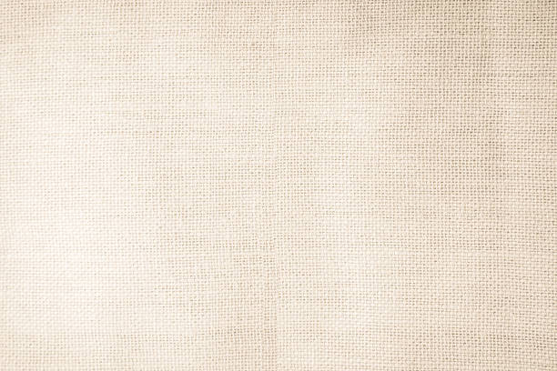 istock Brown sackcloth woven texture background in natural pattern. Jute hessian burlap, linen background in light beige cream color blank. Weaving canvas fiber line cotton cloth textured as organic. 2219099982