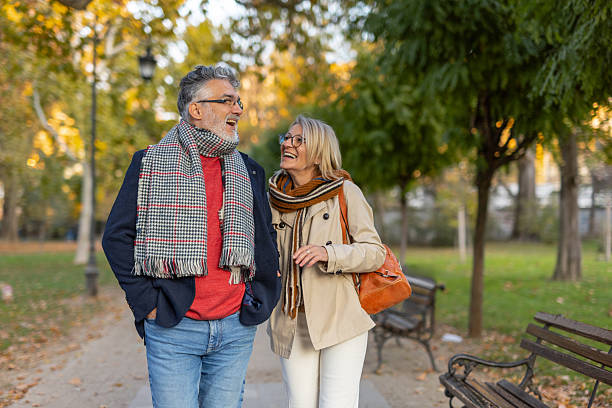 istock Couple Sharing Laughter in Autumn's Vibrant Environment 2219100173