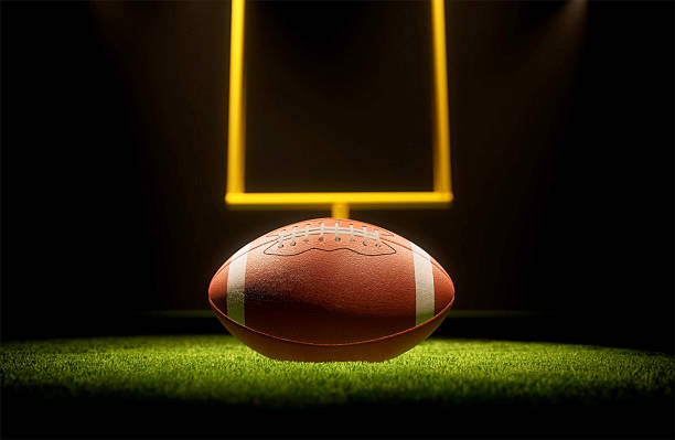 istock Rugby ball with rugby posts on field 2219100608