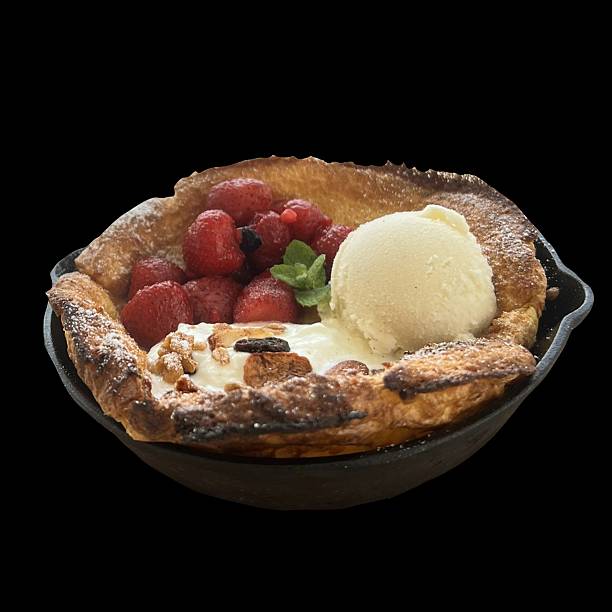 a piece of delicious pie with a strawberry ice cream in a plate