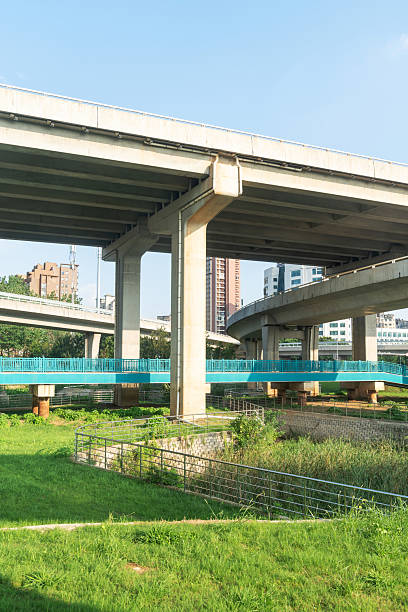 istock Concrete structure and asphalt road space under the overpass in the city 2219104432