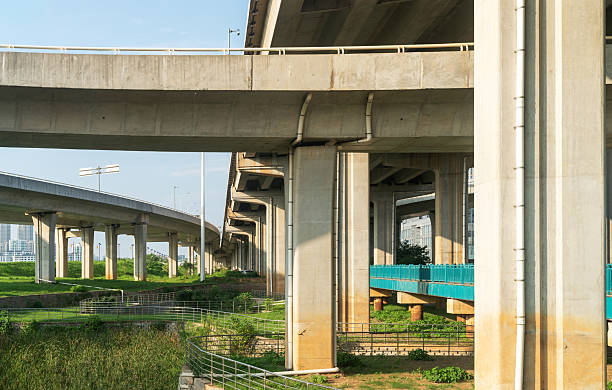 istock Concrete structure and asphalt road space under the overpass in the city 2219104451