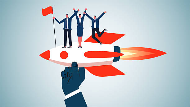 istock Promoting or helping to achieve success or reach a destination more quickly and efficiently, businessmen waving flags standing on rockets propelled forward by large hands 2219105138