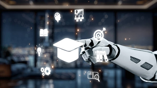 istock Futuristic robotic hand interacting with digital education symbols in modern workspace showcasing technology, learning, innovation, and artificial intelligence concepts. Auvana 2219105477