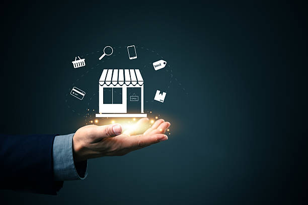 istock Business hand presenting a digital storefront icon with ecommerce startup. Concept of starting online shopping business, digital retail, and innovation in small business entrepreneurship. 2219105906