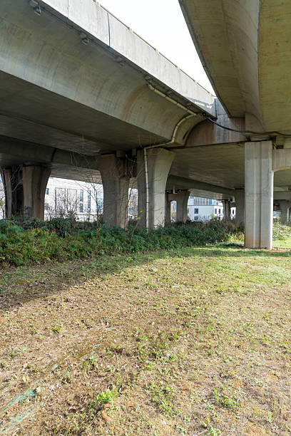 istock Concrete structure and asphalt road space under the overpass in the city 2219106141